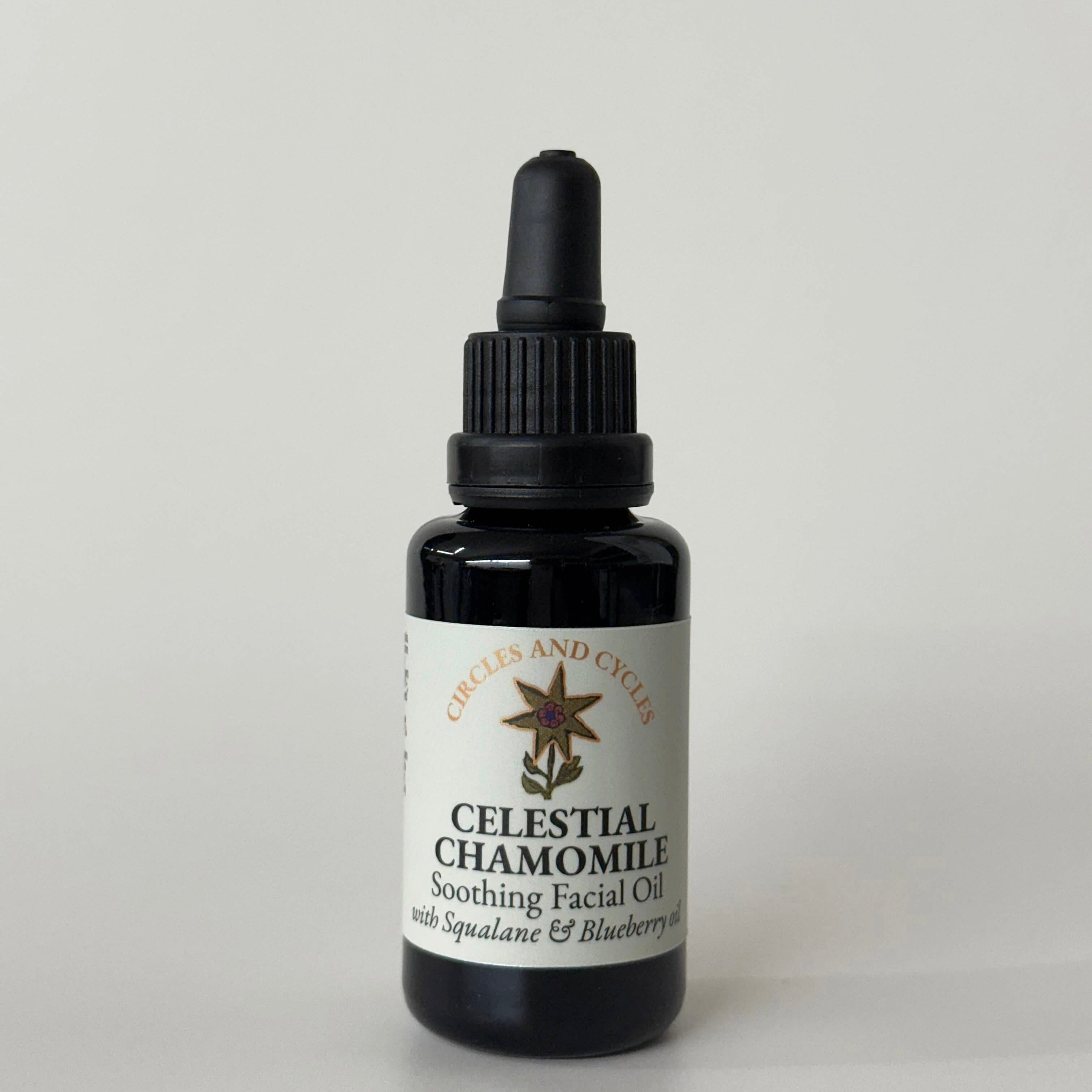 Black bottle of Celestial Chamomile soothing facial oil on a light gray background